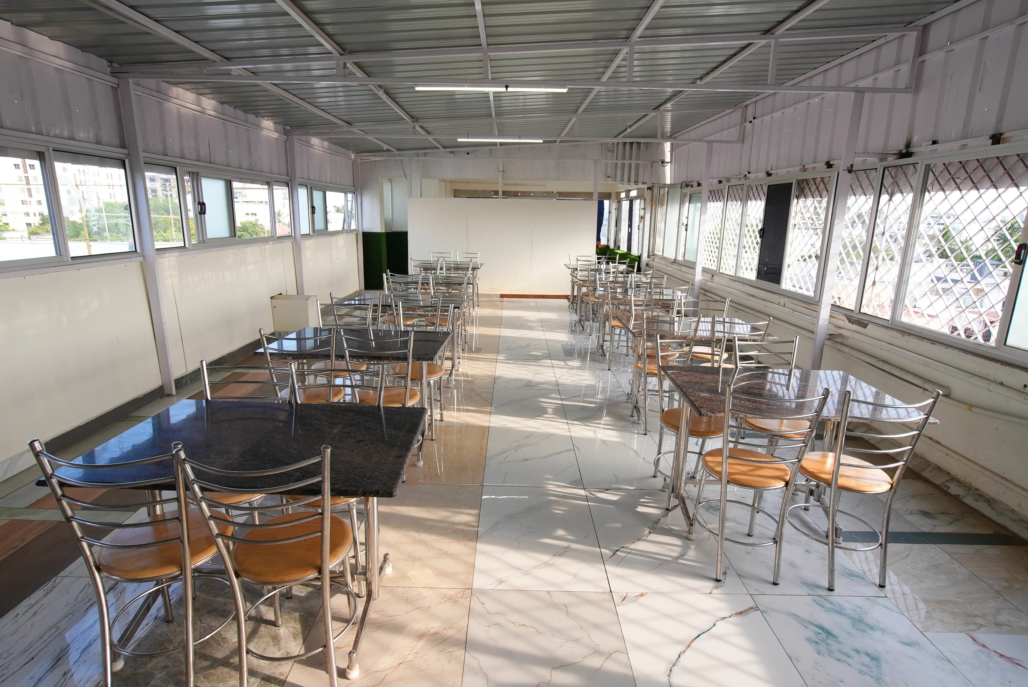 Hygienic Dining Area and Culinary Space at Sri Maha Ladies Hostel